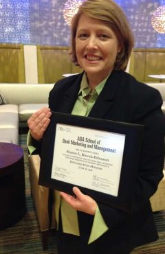 Sharon holding diploma